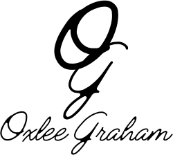 Stylized cursive OG above cursive text that reads "Oxlee Graham"