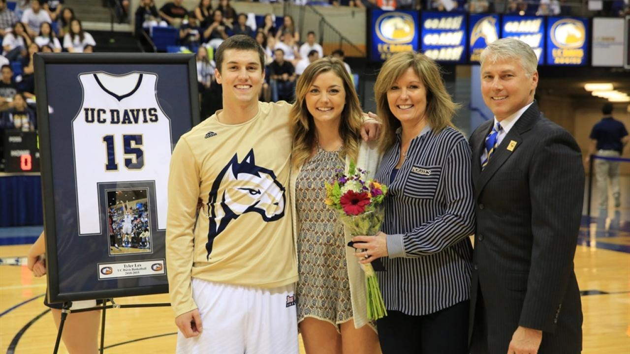 Les family together enjoying a UC Davis basketball game Jim Les