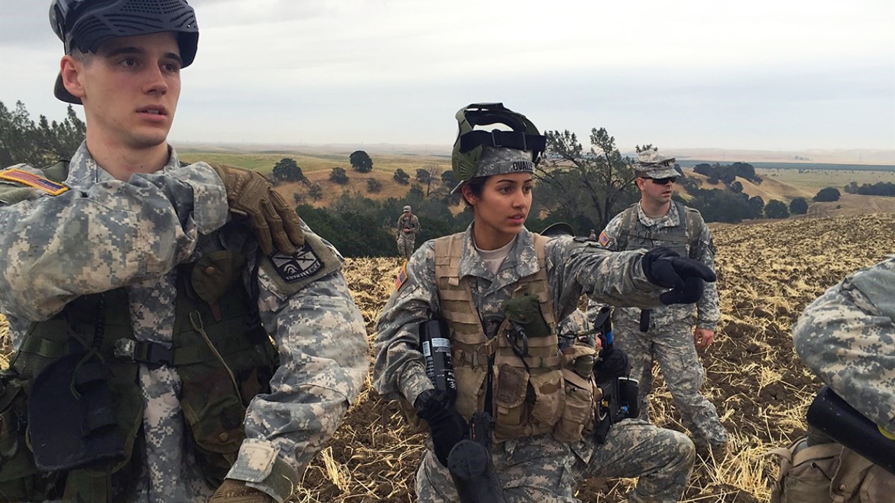 Ovalle directs her platoon to pursue a guerilla squad of cadets on top of a hill during a field exercise in Yolo County meant to prepare her team for summer training at Fort Knox. Pauline Ovalle standing in a field with with her platoon