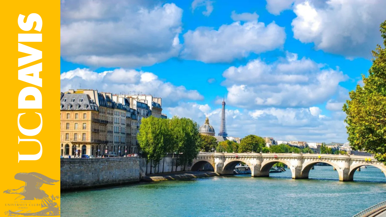 a river with the Eiffel wore in the distance