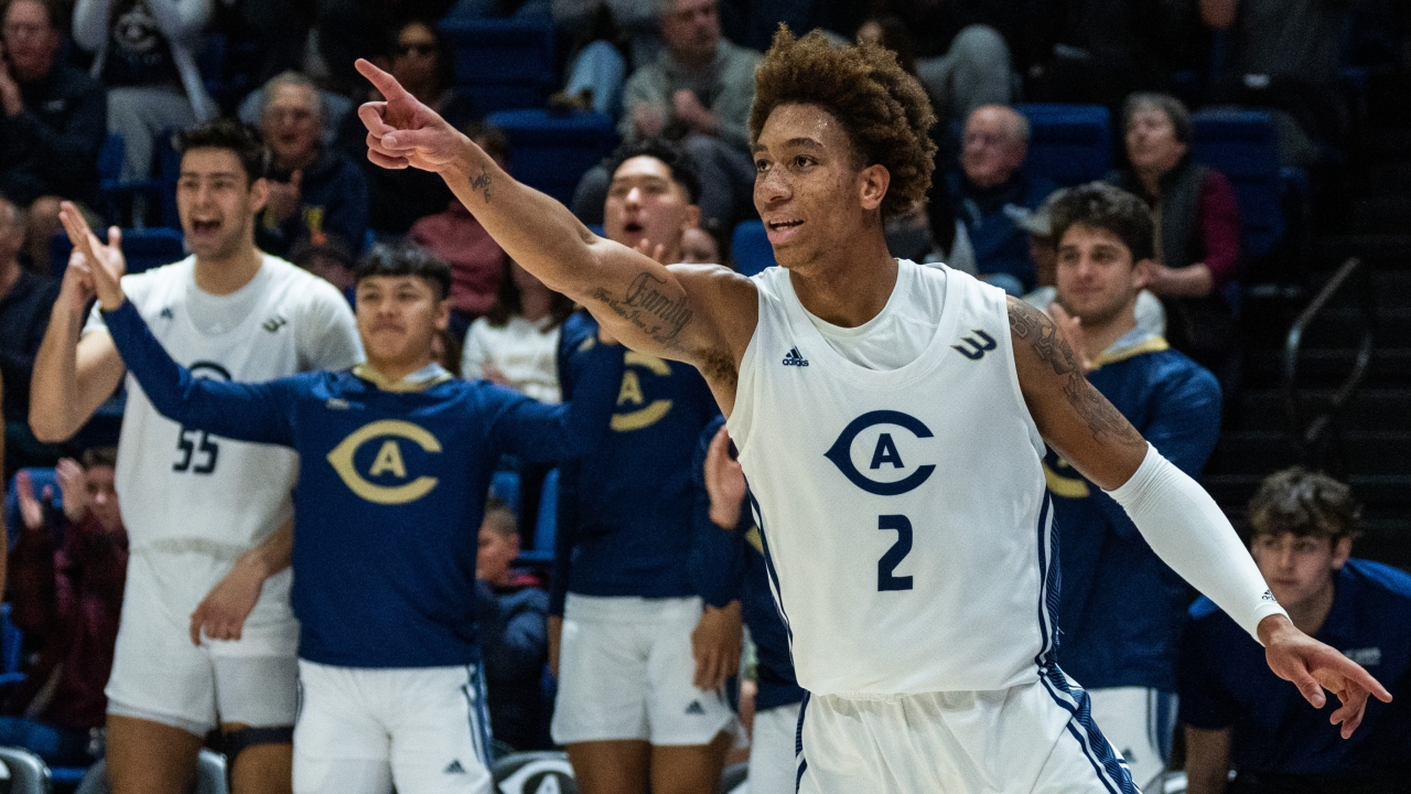 Men's basketball team celebrating