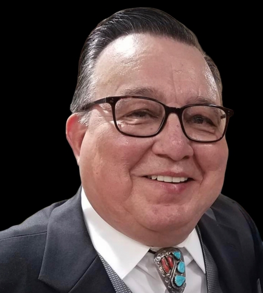 Headshot of Robert Aguallo  wearing a white button-down shirt and a dark blazer.