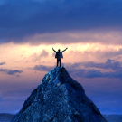 A person at the summit of a mountain