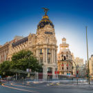 Photo of the Metropolis Building in Madrid, Spain with a blue ribbon on the side with text that reads "Starting a Business in Spain. Hybrid Webinar hosted by the University of California Trust and IE University. Wednesday, February 11, 2026 10:00 PDT (CA), 19:00 CET (Madrid). IE Univerity or VIrtually""